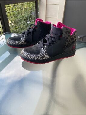Kids Jordan’s Black and Pink Mid-Top Sneakers